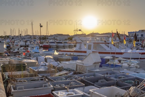 Harbor of Saintes-Maries-de-la-Mer, the capital of the camargue in the south of France at evening time