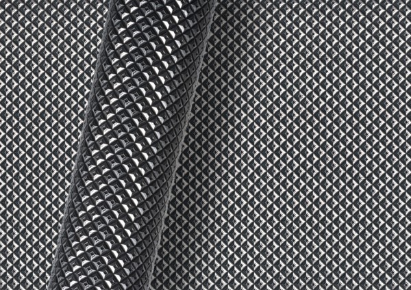 Rolled textured glossy surface over full frame textured background