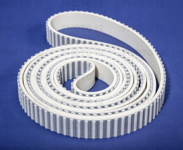 A white rolled drive belt in blue back