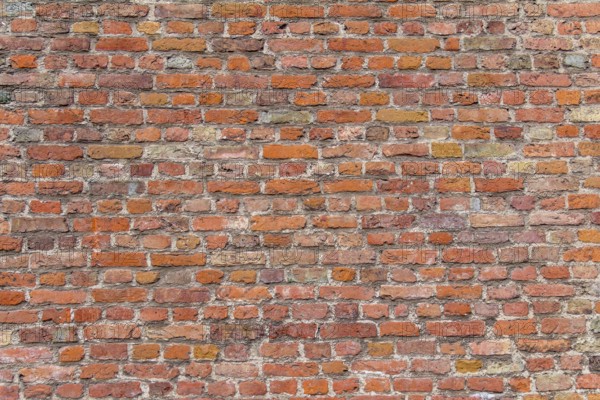Full frame rundown red brick wall detail