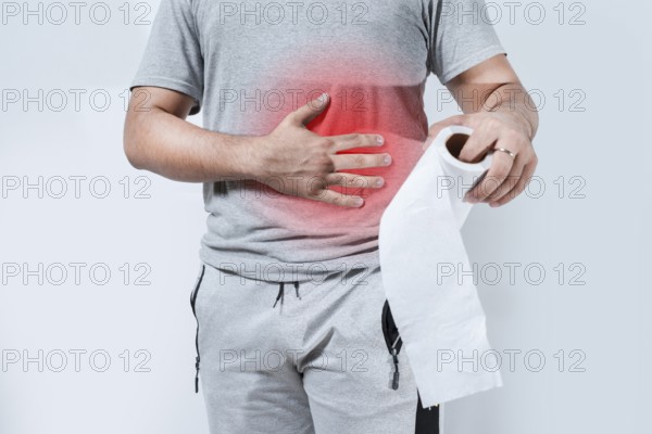 Person with digestive problems holding toilet paper isolated. Digestive disease concept