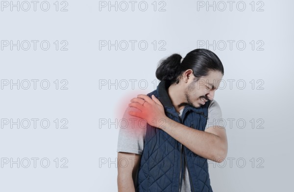Man with shoulder pain highlighted in red. Shoulder pain concept on isolated background