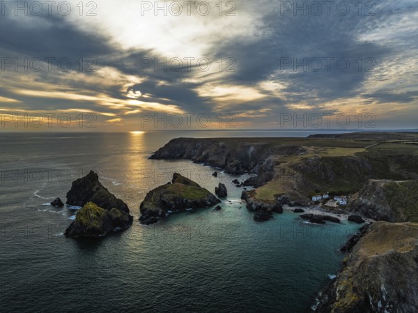Sunset over Kynance Cove from a drone, Mount's Bay, Lizard Point, Cornwall, England, United Kingdom
