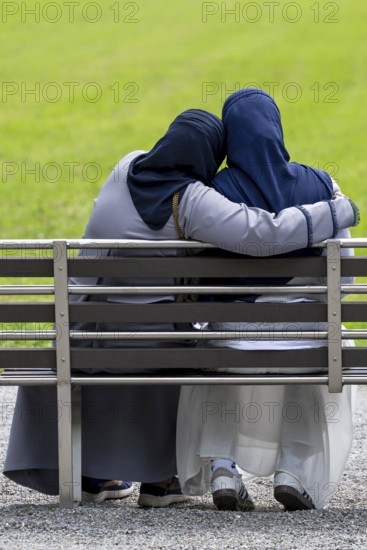 Bench woman couple, Interlaken, Switzerland