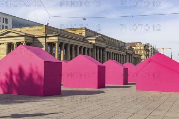 Twelve houses in bright magenta stand on Stuttgart's Schlossplatz in front of the art museum. The Pforzheim-based architecture artist Andreas Sarow developed the Exkursion art project. Stuttgart, Baden-Württemberg, Germany