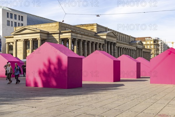Twelve houses in bright magenta stand on Stuttgart's Schlossplatz in front of the art museum. The Pforzheim-based architecture artist Andreas Sarow developed the Exkursion art project. Stuttgart, Baden-Württemberg, Germany