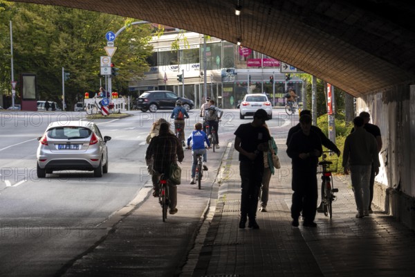 Cycle traffic in Münster, cycle path on Wolbecker Straße, tunnel under the tracks at the main railway station, cycle path red asphalt, marked, city centre of Münster, dense cycle traffic, North Rhine-Westphalia, Germany