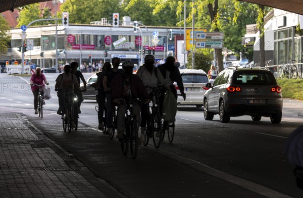 Cycle traffic in Münster, cycle path on Wolbecker Straße, tunnel under the tracks at the main railway station, cycle path red asphalt, marked, city centre of Münster, dense cycle traffic, North Rhine-Westphalia, Germany