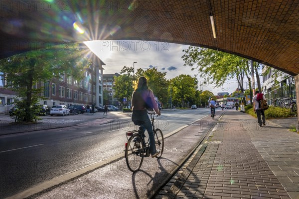 Cycle traffic in Münster, cycle path on Wolbecker Straße, tunnel under the tracks at the main railway station, cycle path red asphalt, marked, city centre of Münster, dense cycle traffic, North Rhine-Westphalia, Germany