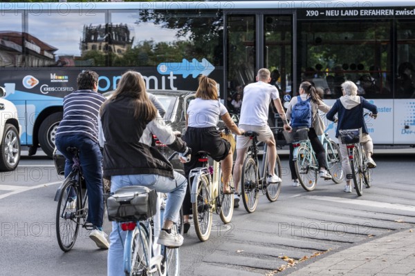 Cycle traffic in Münster, at the intersection of the Ringpromenade, Ludgeristraße to the old town and the Ludgerikreisel roundabout, 2-lane roundabout with over 30, 000 vehicles and over 12, 000 cyclists a day, accident blackspot, cyclists wait for a gap in the traffic to join the roundabout, Münster, North Rhine-Westphalia, Germany