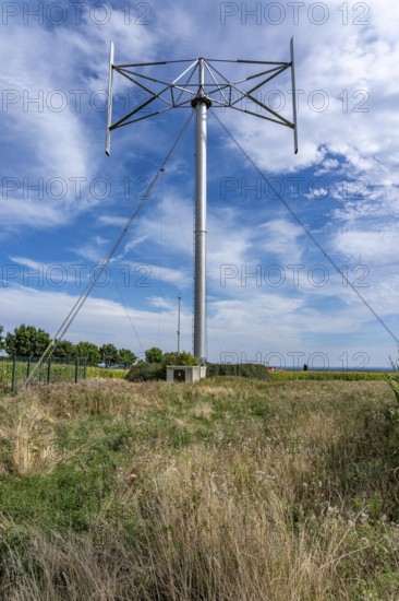 Vertical axis wind turbine, Darrieu wind turbine, 2 vertically mounted rotors rotate around the axis, near Darup in Münsterland, North Rhine-Westphalia, Germany
