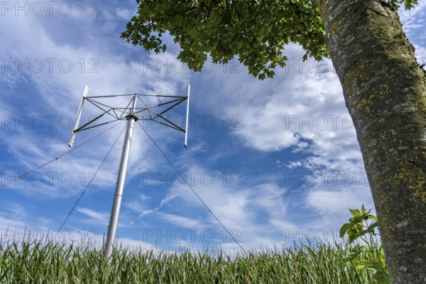 Vertical axis wind turbine, Darrieu wind turbine, 2 vertically mounted rotors rotate around the axis, near Darup in Münsterland, North Rhine-Westphalia, Germany