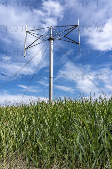 Vertical axis wind turbine, Darrieu wind turbine, 2 vertically mounted rotors rotate around the axis, near Darup in Münsterland, North Rhine-Westphalia, Germany