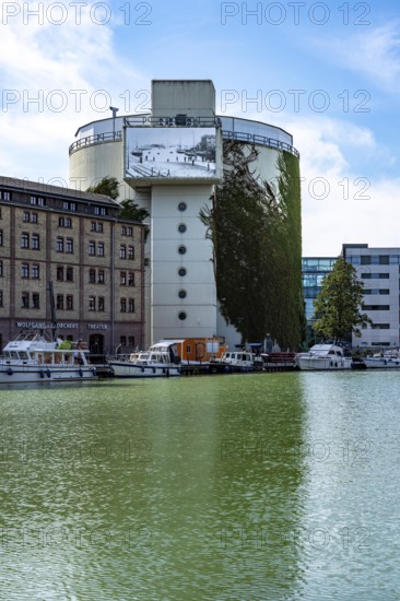 District heating storage in Münster, at the harbour, former coal bunker, 8 million litres of hot district heating water is stored in 4 water tanks, which is released into the district heating network to households as required, the district heating is generated in the neighbouring combined cycle power plant, natural gas power plant, Münster, North Rhine-Westphalia, Germany