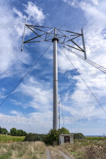 Vertical axis wind turbine, Darrieu wind turbine, 2 vertically mounted rotors rotate around the axis, near Darup in Münsterland, North Rhine-Westphalia, Germany
