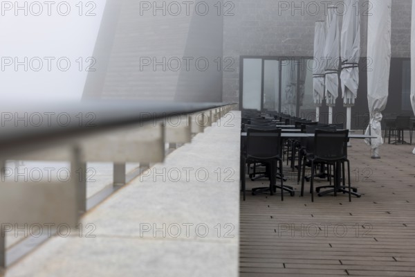 Modern Restaurant Terrace with Railing in the Clouds in a Cloudy Day in Monte Generoso, Ticino, Switzerland