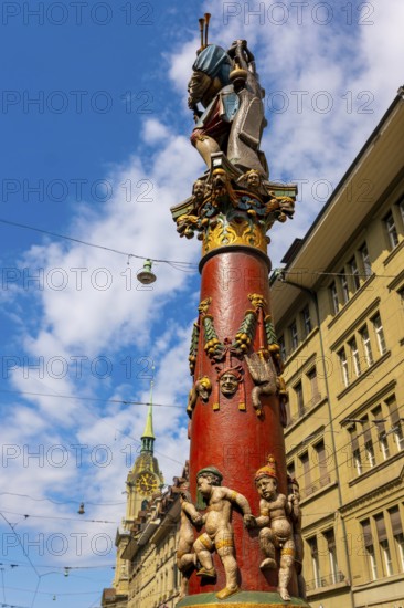 Beautiful Old City with Old Building and Statue and Church Tower in a Sunny Summer Day in City of Bern, Canton Bern, Switzerland