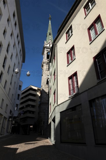 Beautiful City Street and Church Tower with Building and Shop with Blue Sky in a Sunny Summer Day in St Moritz, Grisons, Switzerland