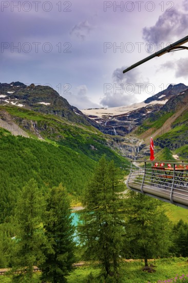 Terrace View over Beautiful Mountain Alp Grüm with Glacier and Alpine Lake Palü in the Swiss Alps in a Cloudy Summer Day in Poschiavo, Bernina, Grisons, Switzerland