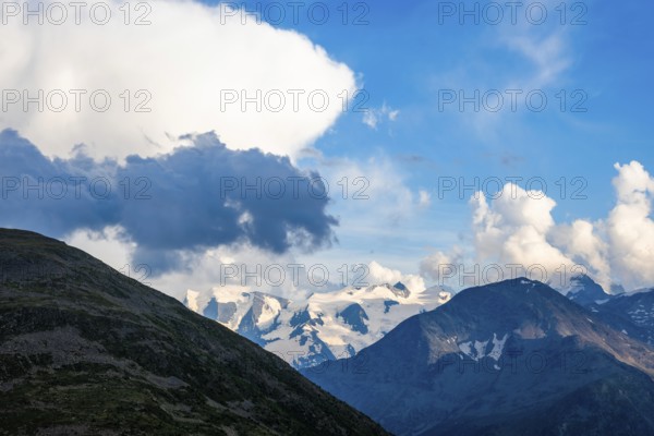 Beautiful Aerial View over Swiss Alps with Glacier in a Sunny Day and Clouds over St Moritz, Maloja, Grisons, Switzerland