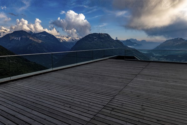 Beautiful Terrace View with Snow and over Alpine Lake and Swiss Alps and Cityscape in a Sunny Day with Blue Sky and Clouds in St Moritz, Maloja, Grisons, Switzerland