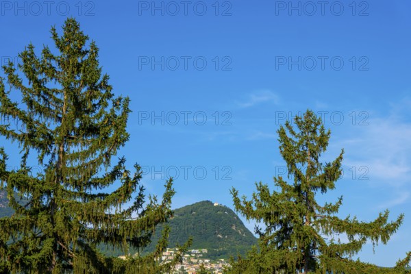 Mountain Bre and Village on Mountain Peak in the Swiss Alps and Blue Sky in a Sunny Summer Day in Lugano, Ticino, Switzerland