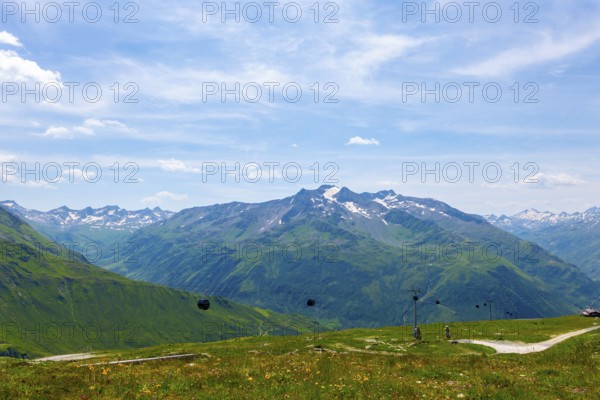 Beautiful Panoramic View over Mountain Peak with Snow in the Swiss Alps From Overhead Cable Car in a Sunny Summer Day in Andermatt, Uri, Switzerland