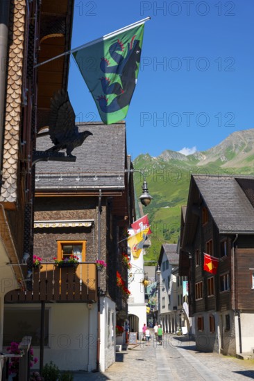 Beautiful City Street in Old Town with Houses and Hotel and with Mountain in a Sunny Summer Day in Andermatt, Uri, Switzerland