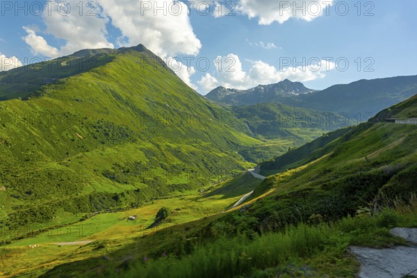 Beautiful Mountain Valley with Mountain Road in the Swiss Alps in a Sunny Summer Day in Andermatt, Uri, Switzerland