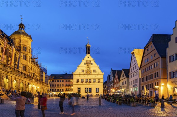 Market square, town hall and council drinking parlour in Rothenburg ob der Tauber at dusk, Bavaria, Germany