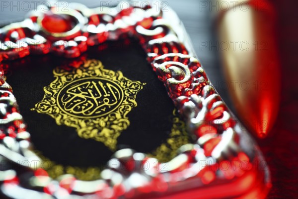 Koran and rifle cartridge, symbolic photo Islamism