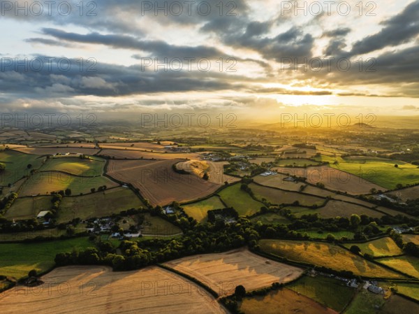Sunset of Fields and Farms over Devon from a drone, Torquay, Torbay, Devon, England, United Kingdom