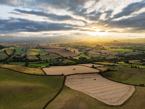 Sunset of Fields and Farms over Devon from a drone, Torquay, Torbay, Devon, England, United Kingdom