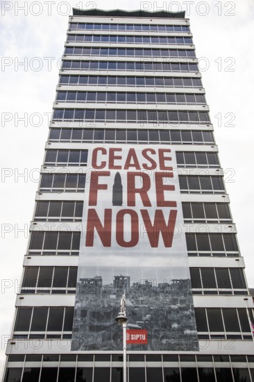 Appeal for peace and ceasefire, poster on a tower block, Dublin, Ireland