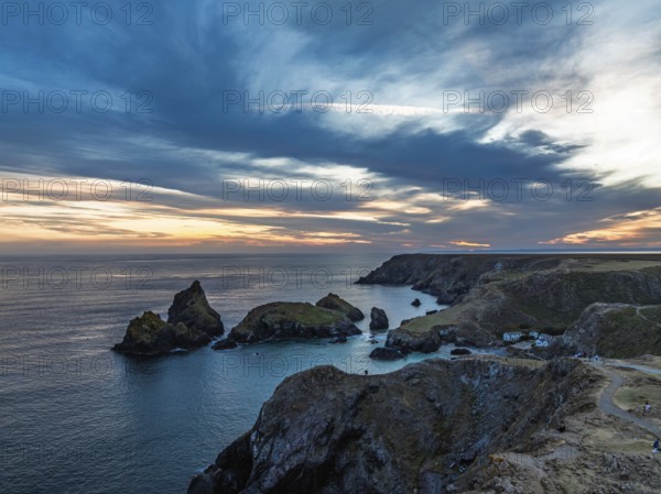 Sunset over Kynance Cove from a drone, Mount's Bay, Lizard Point, Cornwall, England, United Kingdom