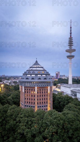 Aerial view of the Schanzenturm in Sternschanzenpark at the Blue Hours with Heinrich Herz Tower, Hamburg, Germany