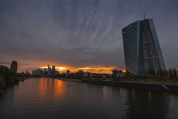 Clouds pass over the headquarters of the European Central Bank (ECB) in Frankfurt am Main at sunset, Frankfurt am Main, Hesse, Germany