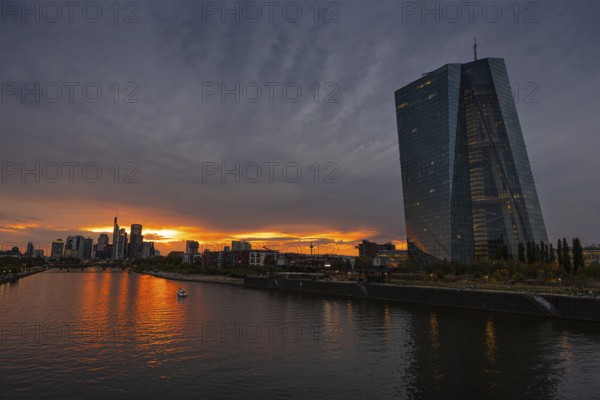 Clouds pass over the headquarters of the European Central Bank (ECB) in Frankfurt am Main at sunset, Frankfurt am Main, Hesse, Germany