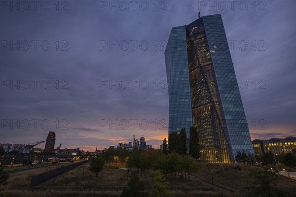 Clouds pass over the headquarters of the European Central Bank (ECB) in Frankfurt am Main shortly after sunset, Frankfurt am Main, Hesse, Germany