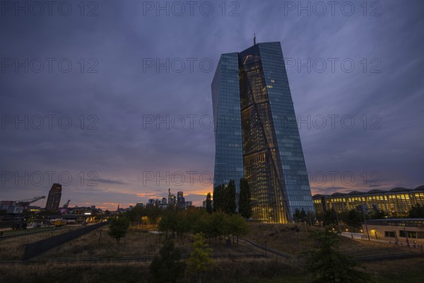Clouds pass over the headquarters of the European Central Bank (ECB) in Frankfurt am Main shortly after sunset, Frankfurt am Main, Hesse, Germany