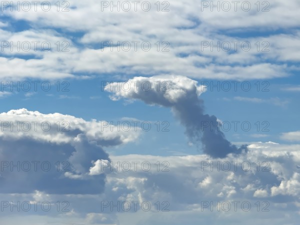 Cumulonimbus cluster cloud towering in the centre of the image, Altostratus above, Stratocumuus below, international