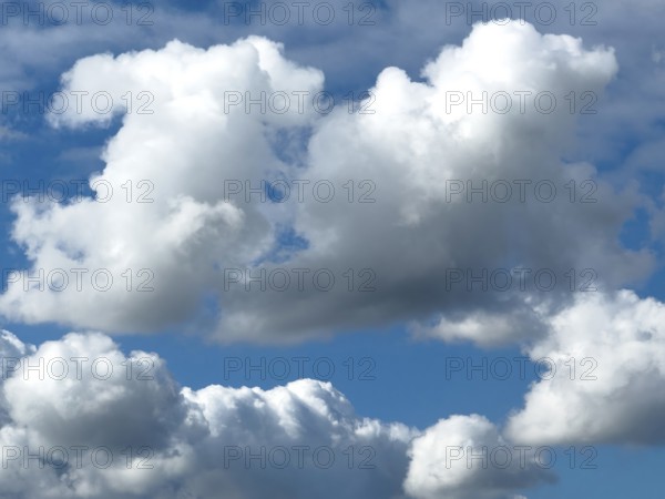 Below white clouds cumulus heap clouds above towering cumulonimbus, international