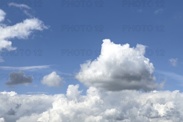 White clouds below cumulus clouds above in the centre of the picture stratocumulus, international