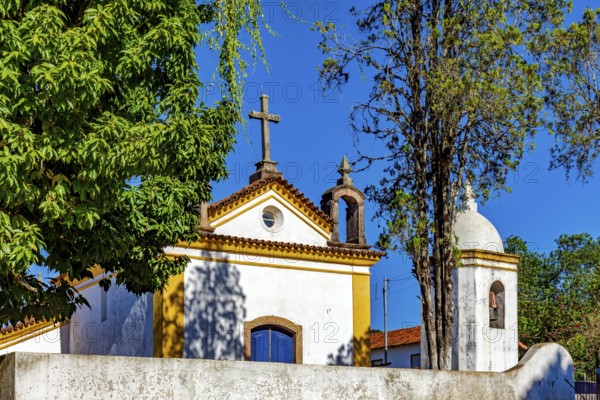 Old church with stone crucifix in the city of Ouro Preto in Minas Gerais