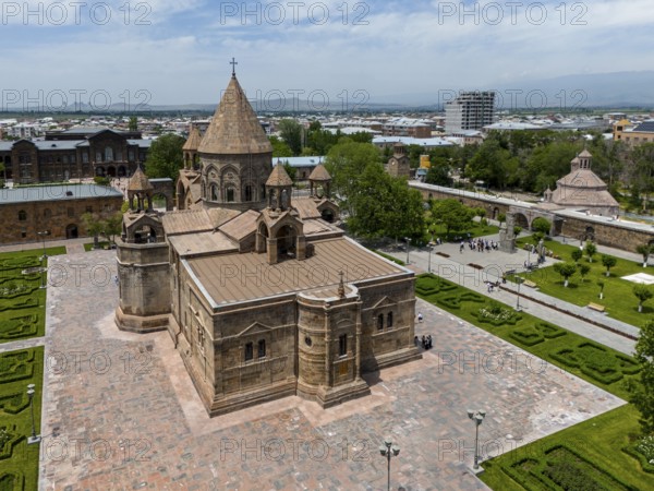 An old church with impressive architecture surrounded by manicured gardens and urban structures, aerial view, historic, most important Armenian Orthodox cathedral, UNESCO World Heritage Site, Echmiadzin, Echmiadzin, Ejmiacin, Vagharshapat, Vagharshapat, Vagharshapat, Valaršapat, Vagharshapat, Armavir province, Armenia