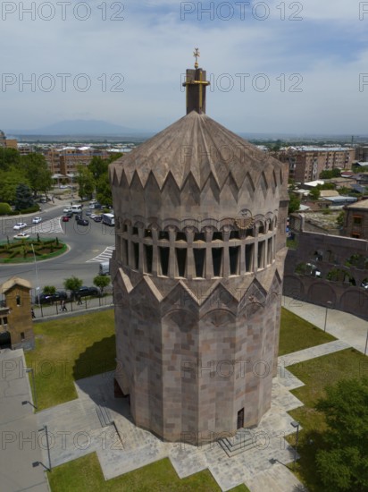 Distinctive stone tower in an urban setting under a blue sky, aerial view, Holy Archangel Church, Echmiadzin, Echmiadzin, Ejmiacin, Vagharshapat, Vagarshapat, Valaršapat, Vagharshapat, Armavir Province, Armenia