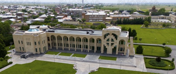 A modern building with geometric patterns surrounded by green spaces and streets, aerial view, guardhouse and Tamar Manukyan Library, Matenadaran, Echmiadzin, Echmiadzin, Ejmiacin, Vagharshapat, Vagharshapat, Vagharshapat, Valaršapat, Vagharshapat, Armavir Province, Armenia