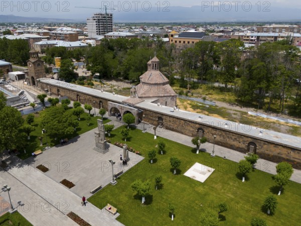 Historical monastery complex in the middle of a green park with city view and mountains in the background, aerial view, St. Vardan and St. Hovhannes Chapel-Baptistery, Echmiadzin, Echmiadzin, Ejmiacin, Vagharshapat, Vagharshapat, Valaršapat, Vagharshapat, Armavir Province, Armenia