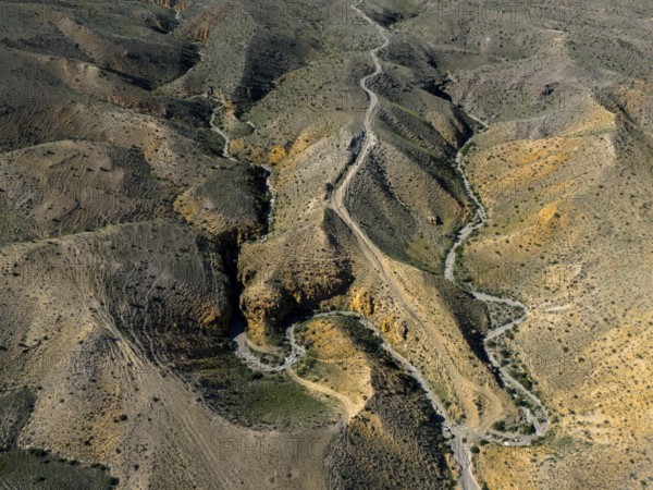 Aerial view of winding hills with a winding road through rocky landscape, aerial view, Angel's Canyon, canyon, Dashtakar, Ararat province, Armenia