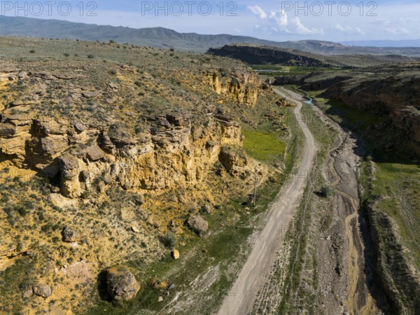 Geological formations along a dirt road in a barren landscape, aerial view, landscape at Angel's Canyon, gorge, Dashtakar, Ararat Province, Armenia